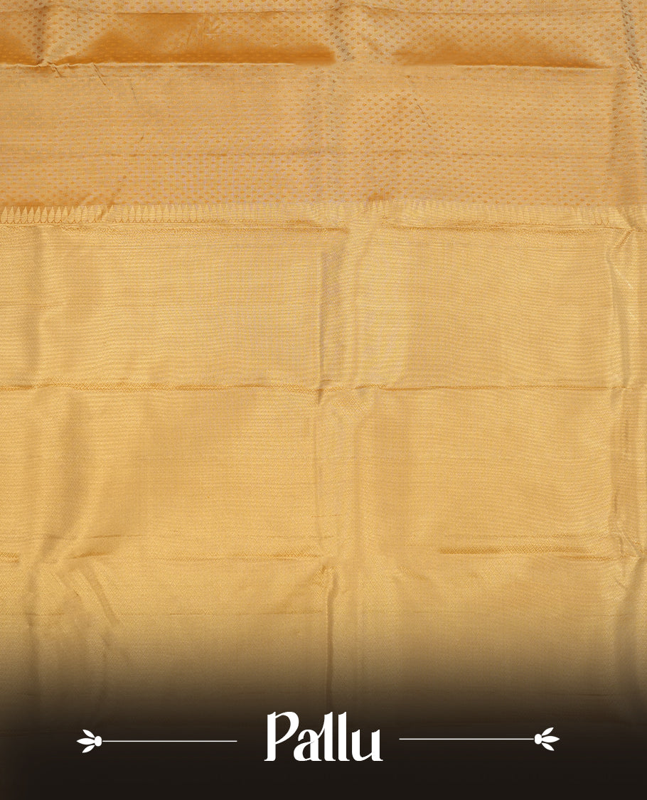 Muted Brown colour Vasundhara silk saree adorned with all-over self coloured motifs on the body, complemented by a self coloured with tiny daimond pattern with gold tree motifs border and paired with a matching blouse piece.