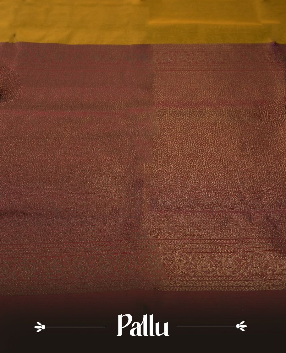 Golden brown colour soft silk cotton saree adorned with floral motifs and Enhanced by a beautifully rich maroon floral woven contrasted pallu & Comes with a matching blouse piece for a complete look.