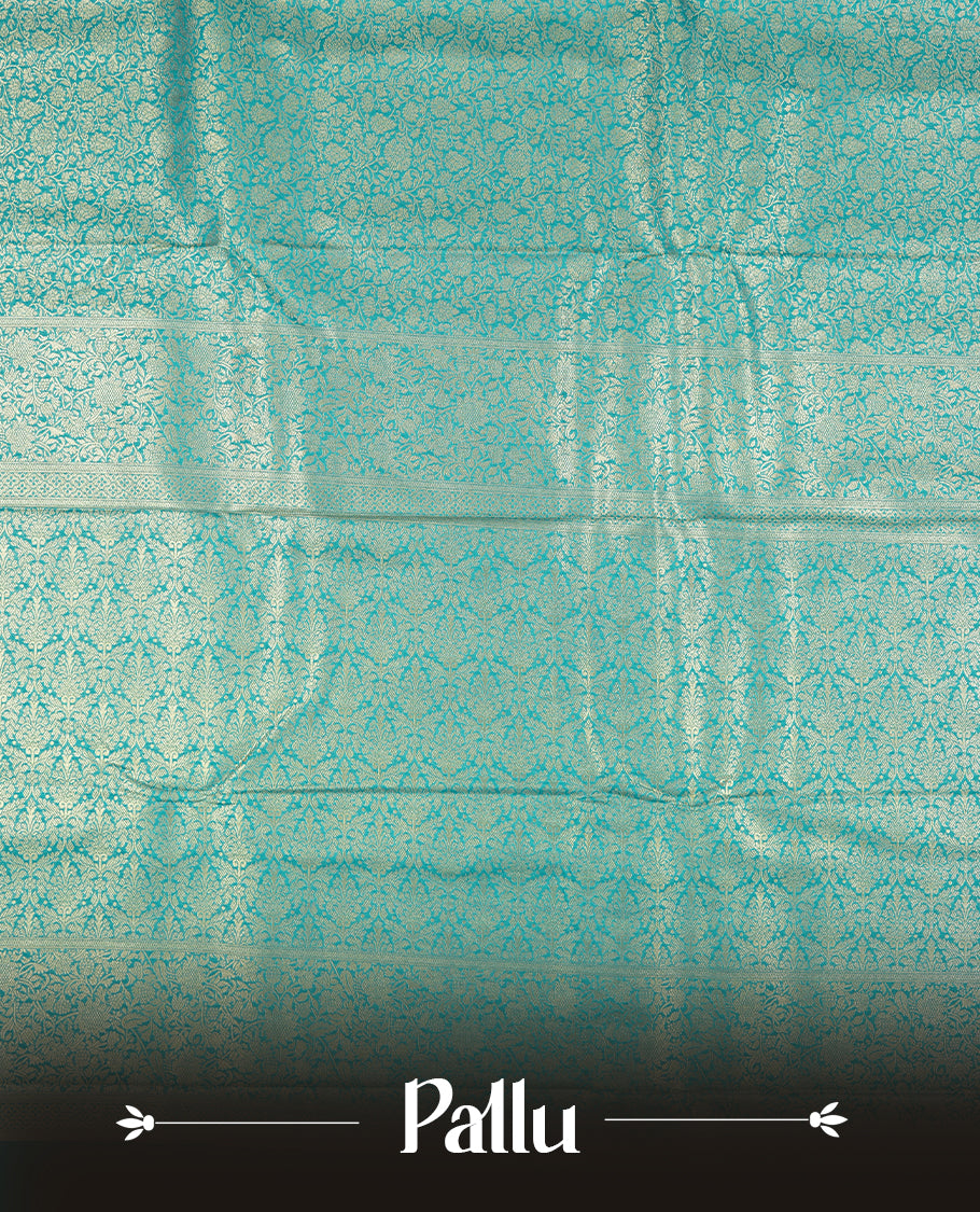 Aqua blue colour semi silk brocade saree featuring intricate Gold Floral kodi patterns across the body, complemented by a rich self colour woven border and pallu, paired with a matching blouse.