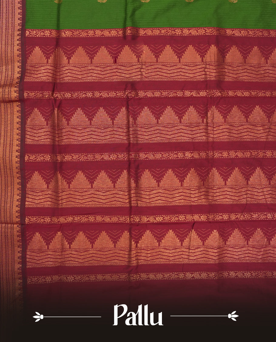 Olive green colour Kalyani Cotton saree with maroon border and temple motifs on pallu, adorned with copper zari motifs and intricate weaving & Comes with a matching blouse piece.
