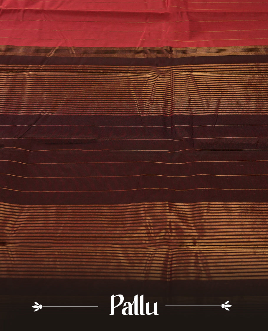 Maroon colour silk cotton saree featuring with delicate vertical copper zari lines on the body, Crafted without a border for a classy touch, Comes with a matching blouse for a perfectly coordinated look.