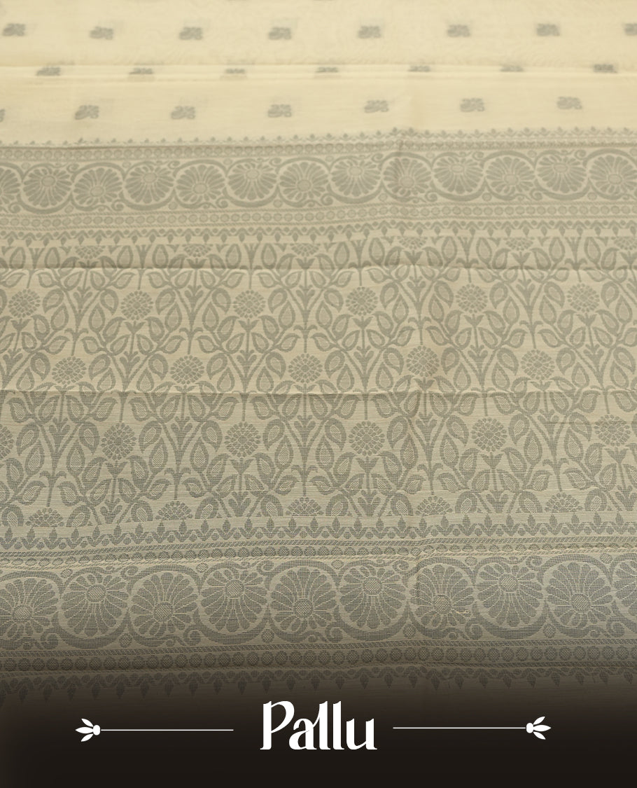 Sandal colour silk cotton saree featuring subtle elegant floral woven motifs on the body, complemented by a classic contrast grey colour border and pallu with intricate traditional detailing & Comes with a matching blouse piece.