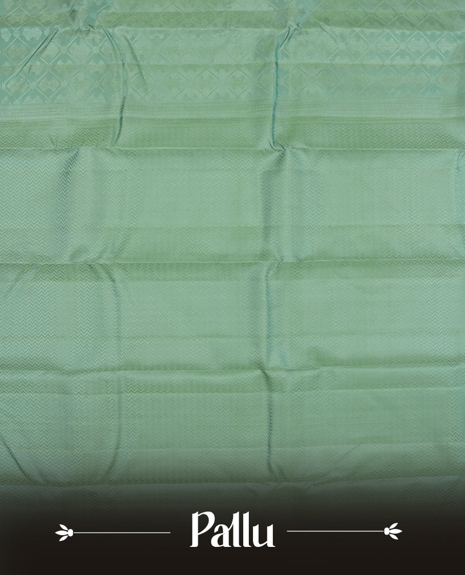 Mint Green colour semi soft silk saree featuring a self coloured textured square motufs on body, complemented by self coloured Square motifs pallu & border and a matching blouse piece.