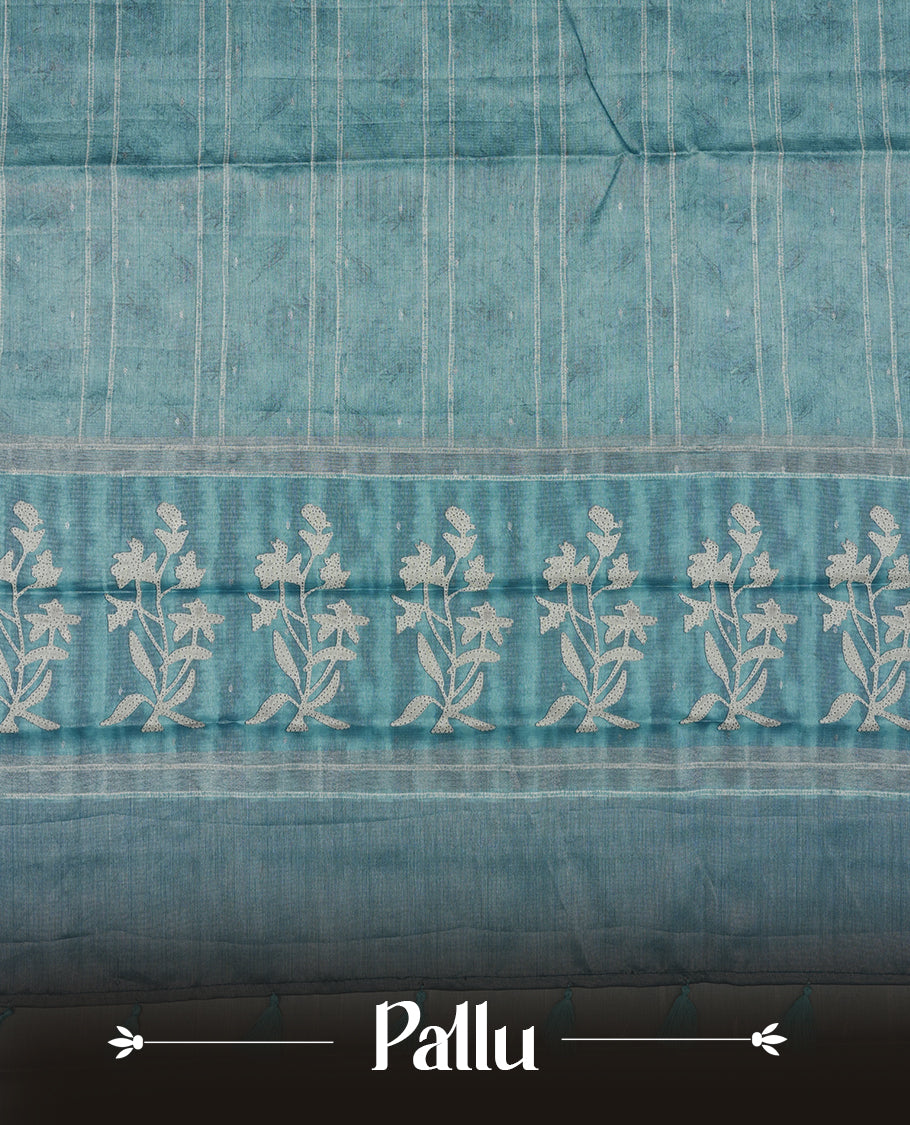 Light Aqua Blue colour semi tussar saree adorned with Cream strip printed pattern across the body and Floral pattern contrast Aqua Blue colour on border, paired with a matching blouse.