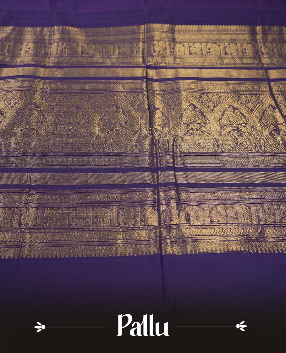 Purple colour pure Kanchi cotton saree embellished with delicate golden buttas and a graceful zari deer motif, paired with an intricately woven gold border, radiating elegance and tradition & Comes with matching blouse.
