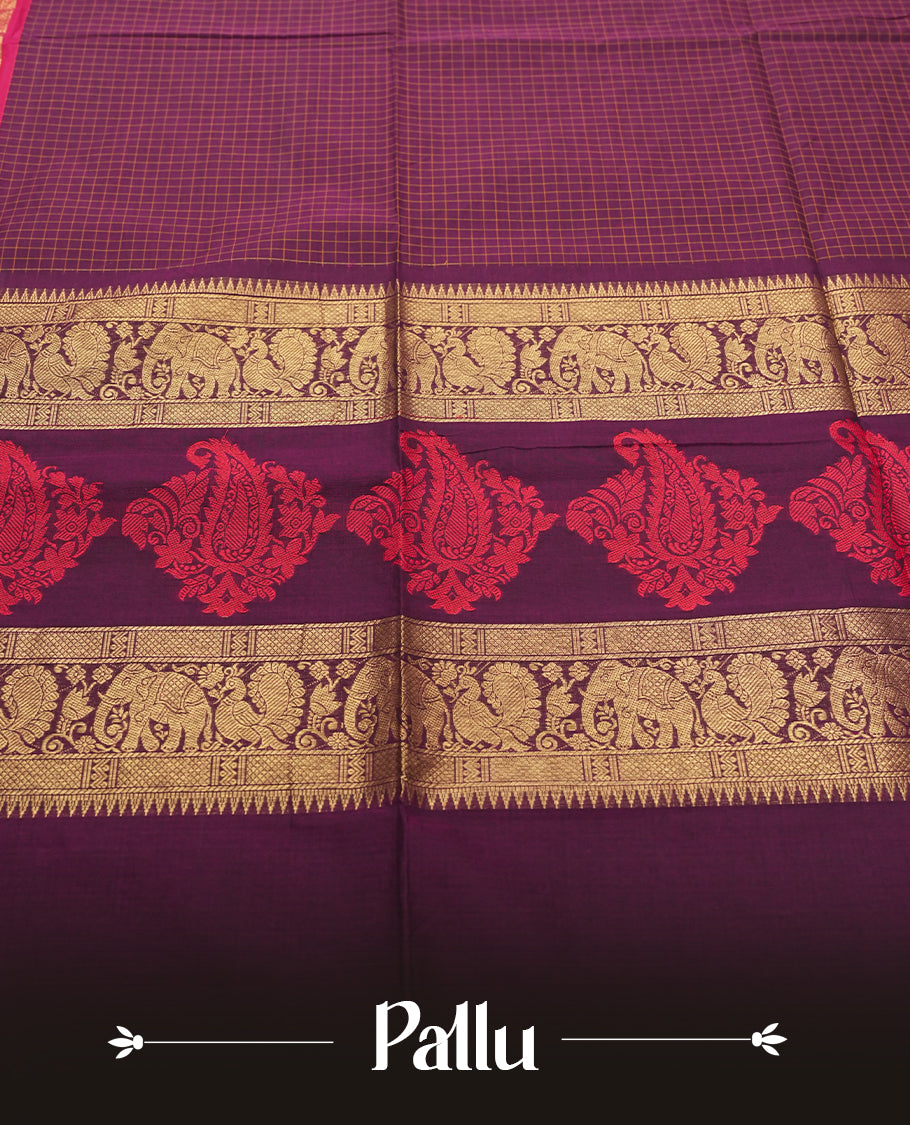 Maroon Colour silk cotton saree with gold zari elephant and floral design on the border, contrast pallu with traditional motifs, and a coordinated maroon blouse carrying the same rich zari border.