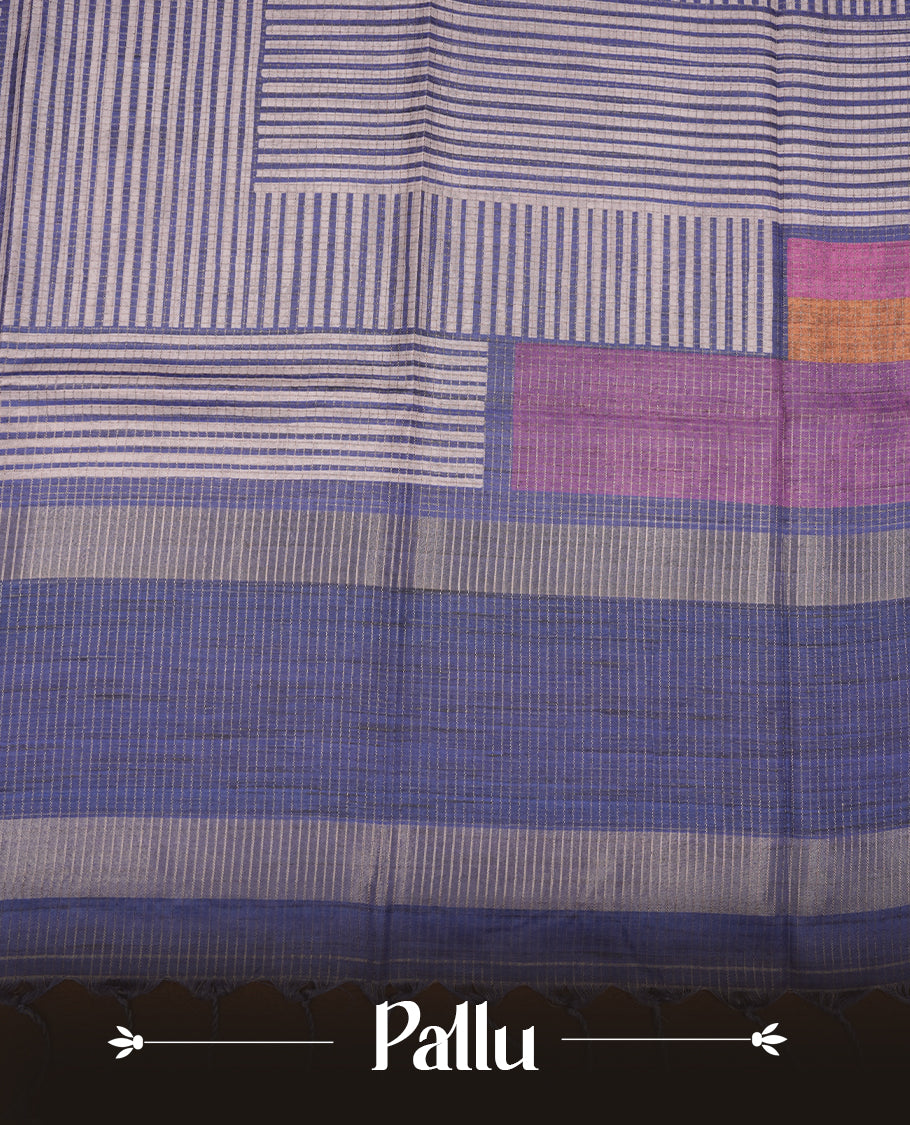 Blue colour semi tussar silk saree with fine striped texture and a subtle geometric body design. Finished with a classic striped pallu and tassel edges.