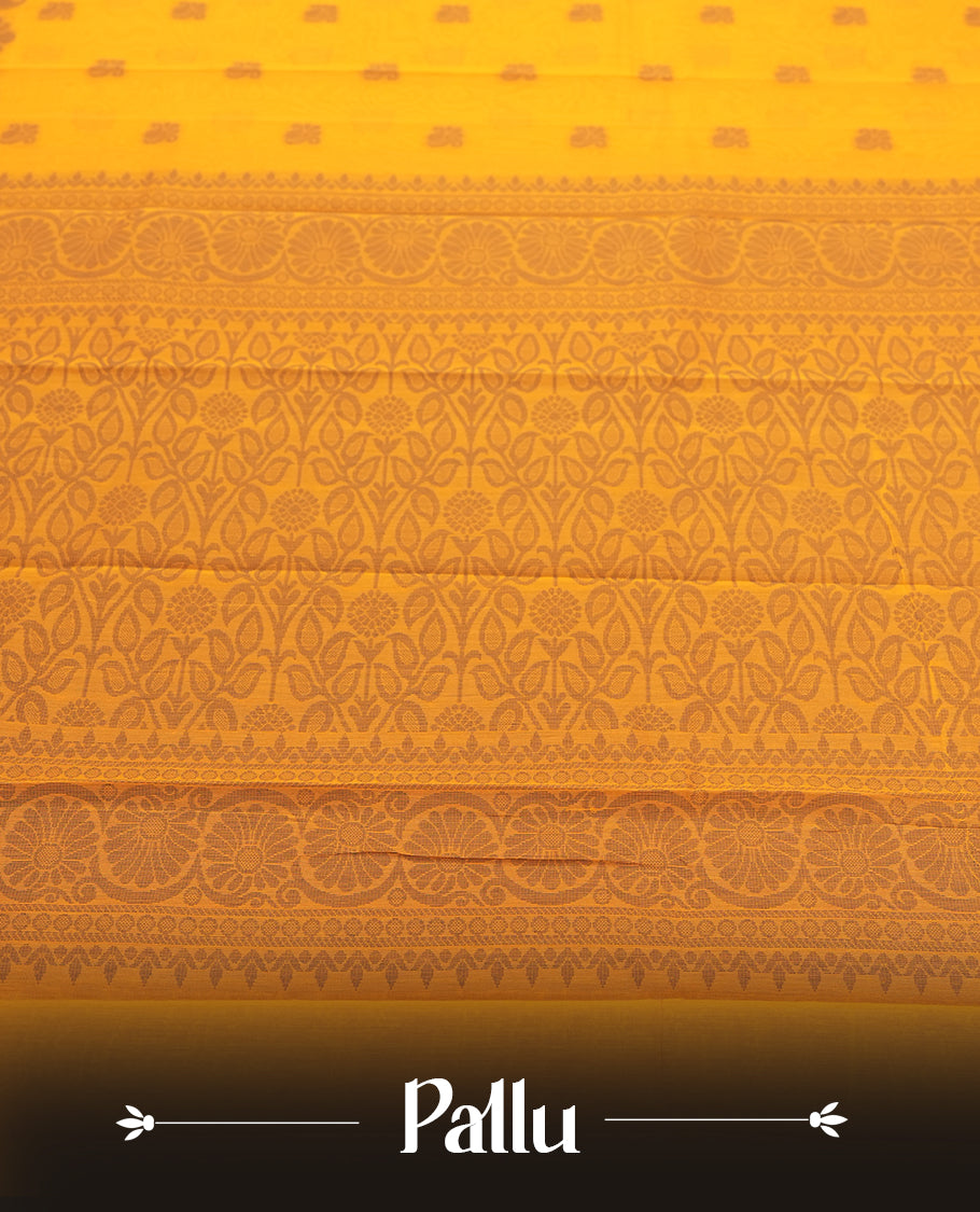Saffron orange colour silk cotton saree featuring elegant grey floral and geometric woven motifs across the body, paired with a deep contrast grey border and pallu showcasing intricate traditional patterns & Comes with a matching blouse piece.