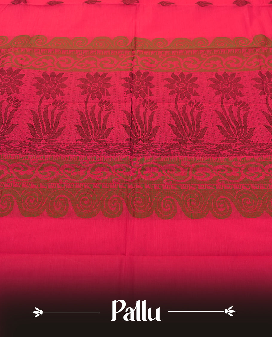 Rani Pink colour Silk Cotton Saree with Antique Copper Zari Border and Micro Geometric Edge, Body adorned with Subtle Leaf Buttas, Floral Jacquard Pallu, and a Coordinated Rani Pink Blouse with Matching Zari Border