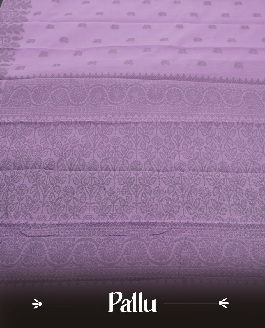 Lavender colour silk cotton saree featuring elegant floral zari motifs on the body, complemented by a rich contrast dark grey border and pallu with traditional woven detailing & Comes with a matching blouse piece.