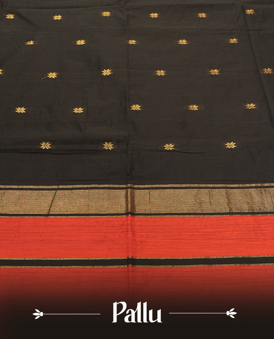 Black colour Silk Cotton Saree with Contrasting Rust Red Top Border, Antique Gold Zari Temple Border and Butta Motifs, Finished with Tassel Detailing and a Coordinated Matching Blouse Piece