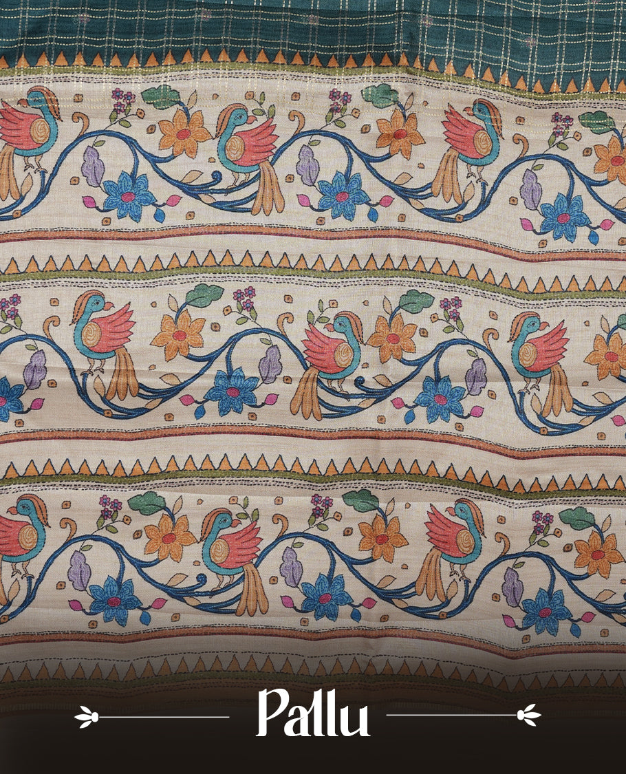 Dark green colour semi tusser silk saree featuring gold zari check pattern with floral butti motifs, with contrast floral kodi & bird pattern and paired with matching blouse.