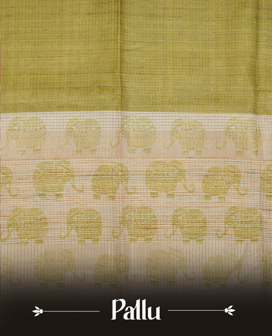 Green colour semi tussar silk saree featuring Antique zari check pattern across body, contrast Cream colour border with elephant print and pallu, paired with matching blouse piece.