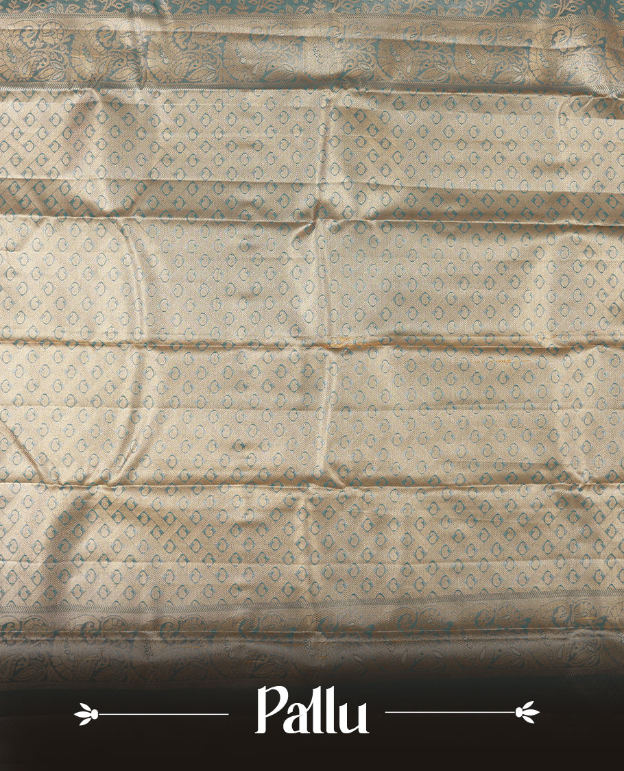 Blue colour tissue brocade saree with delicate floral and leaf motifs in antique gold zari work throughout body. Ornate gold border and pallu with traditional floral scrolls, navy blue accents. Includes coordinating blouse.