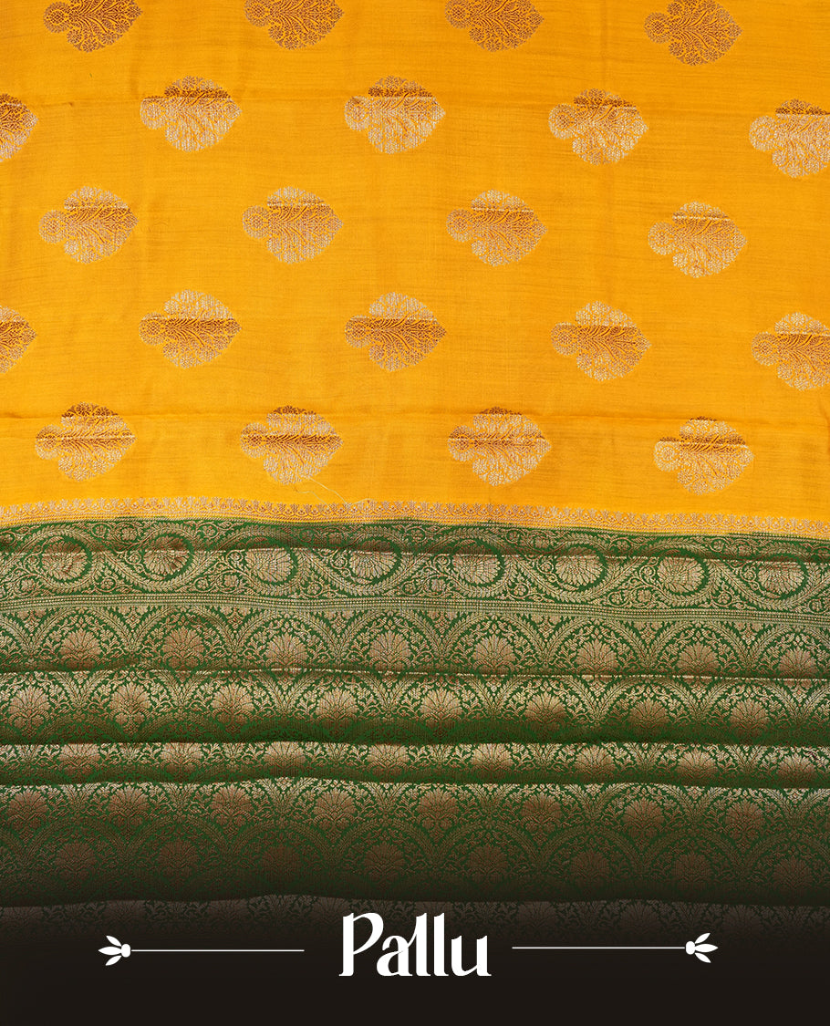 Mustard Colour Pure Banaras soft Silk Saree having gold floral motifs on Body with contrast green colour gold Floral kodi pattern on Border and matching Blouse