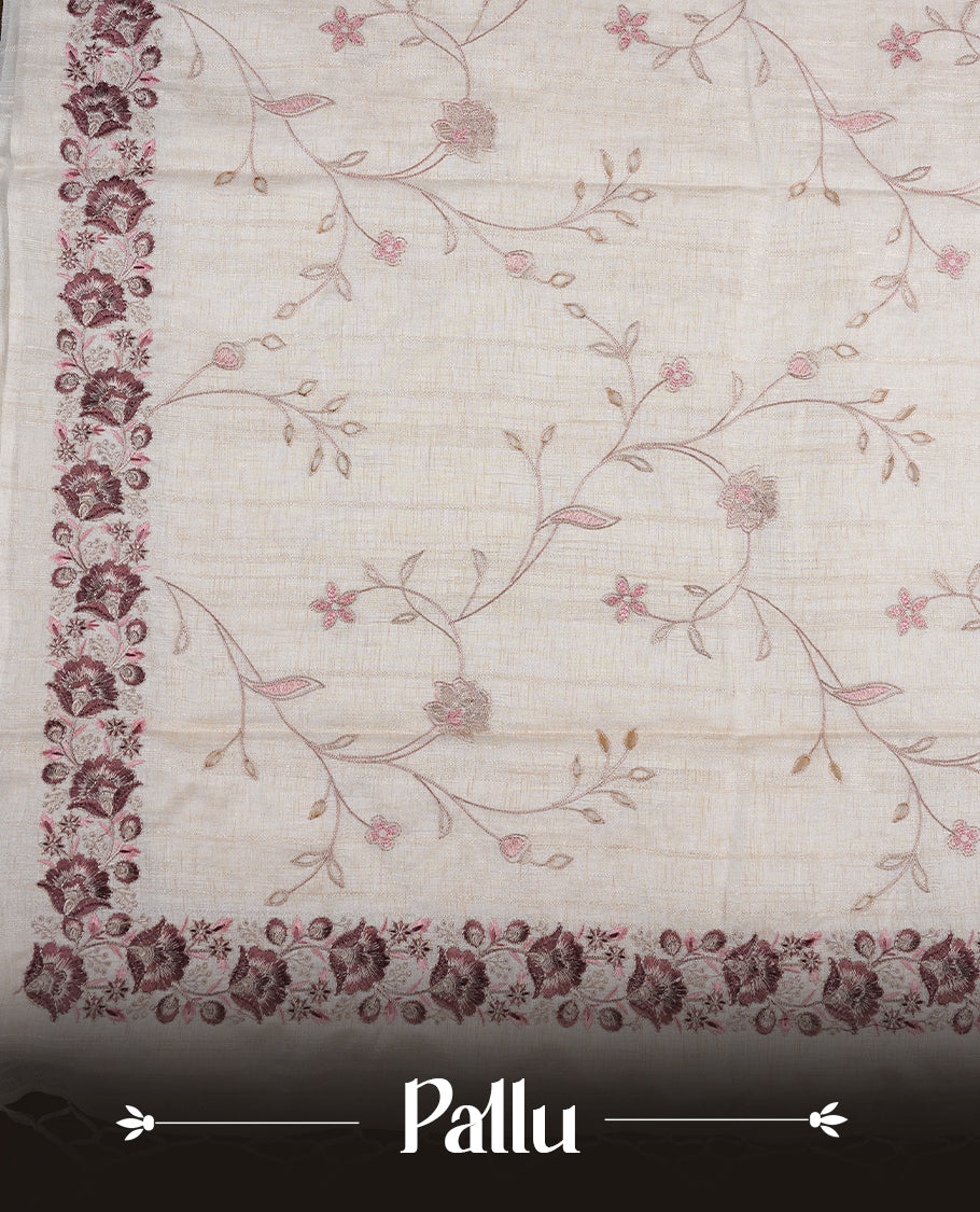 Cream colour semi tusser silk saree featuring with brown colour thread embroidery kodi pattern all over body, pallu, border and paired with matching blouse piece.