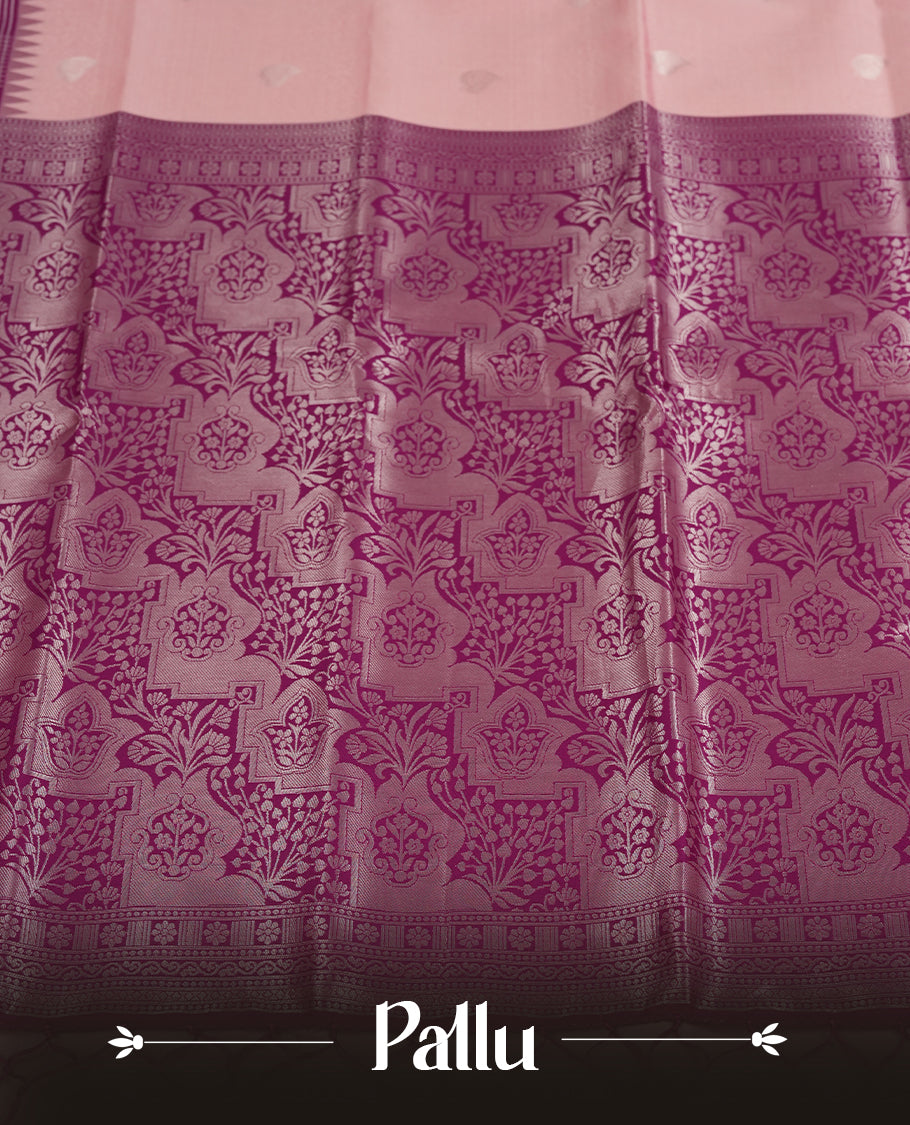 Light pink colour semi silk saree adorned with silver leaf motifs on the body, complemented by a purple pallu intricately woven with rich floral patterns border and pallu, and paired with a matching blouse