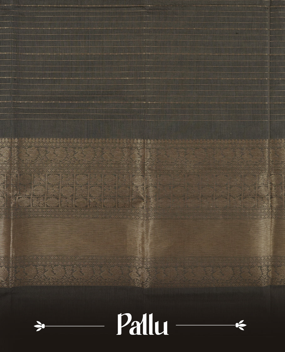 Grey colour Chettinad cotton saree featuring fine golden zari lines on the body, The contrasting black border is richly woven with intricate zari floral and paisley motifs & Comes with a matching blouse piece.