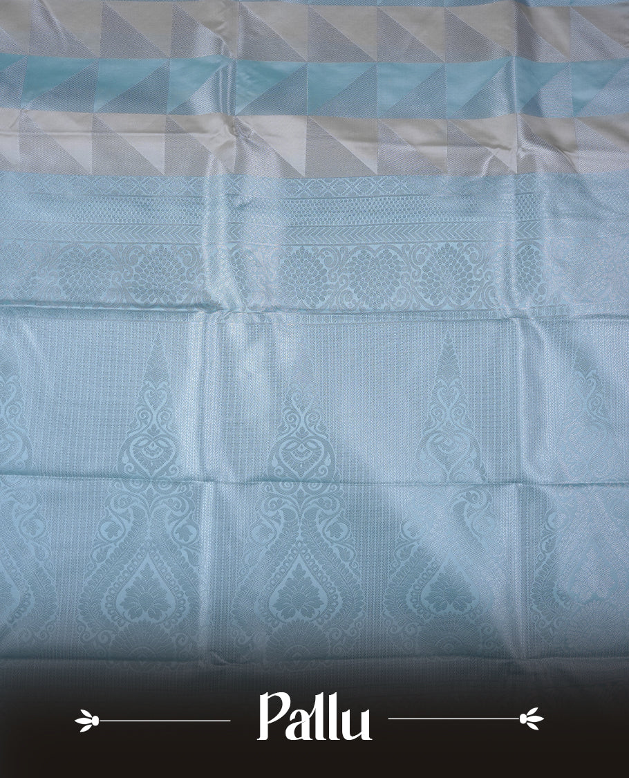 Ice blue & cream colour semi soft silk saree featuring a silver zari patterned body, complemented by silver zari motifes on pallu & border and a matching blouse piece.