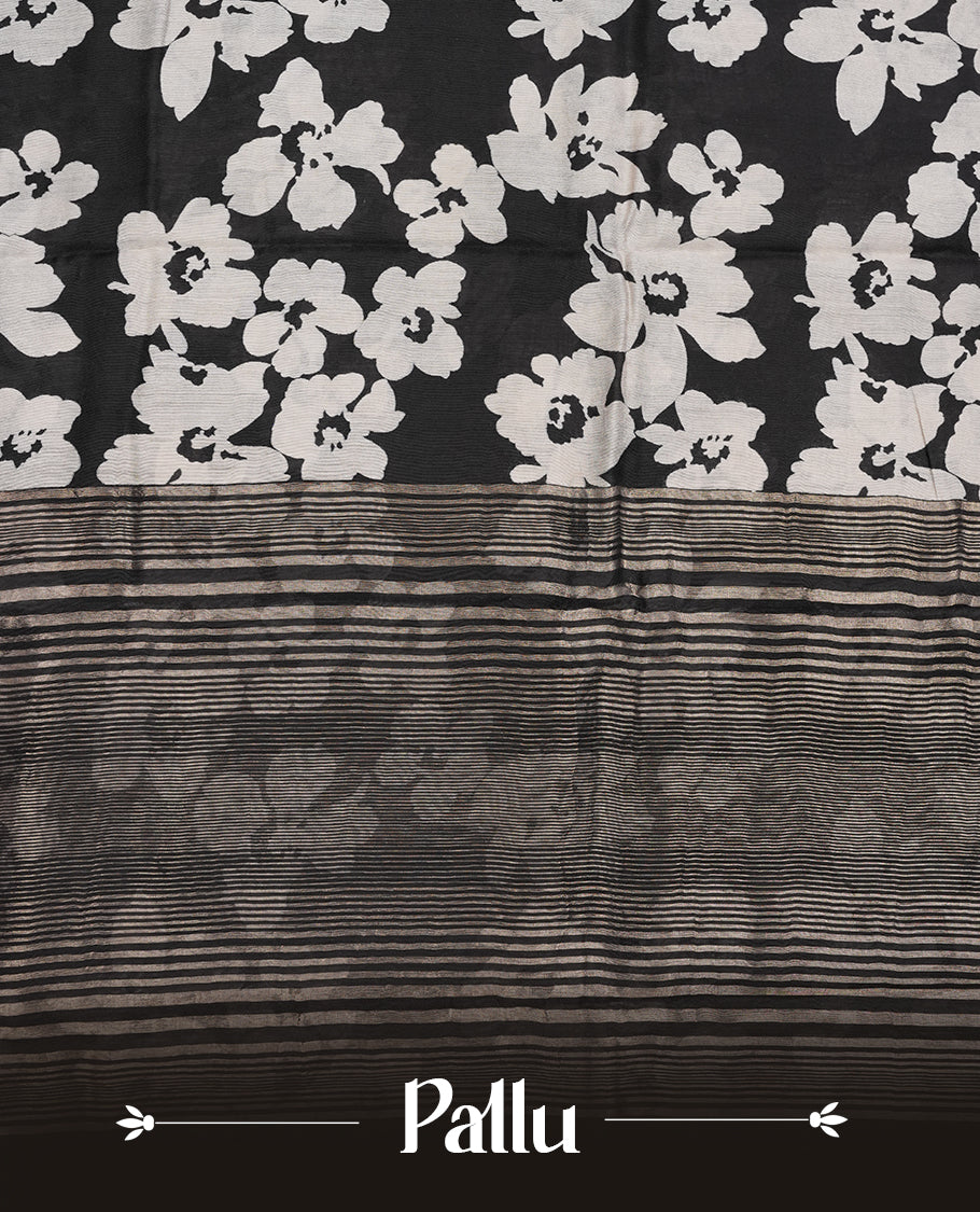 Black colour Viscos semi printed saree featuring a light golden zari border, abstract off white printed motifs on the body, and comes with a matching blouse