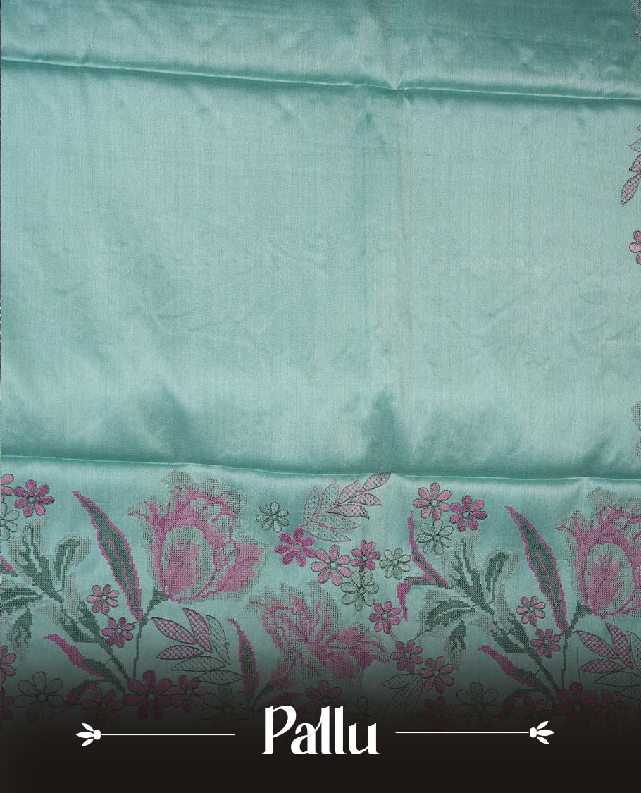 Pastel blue colour Pure tusser silk saree featuring finely crafted floral thread embroidery detailing on the border, pallu and with matching blouse piece.