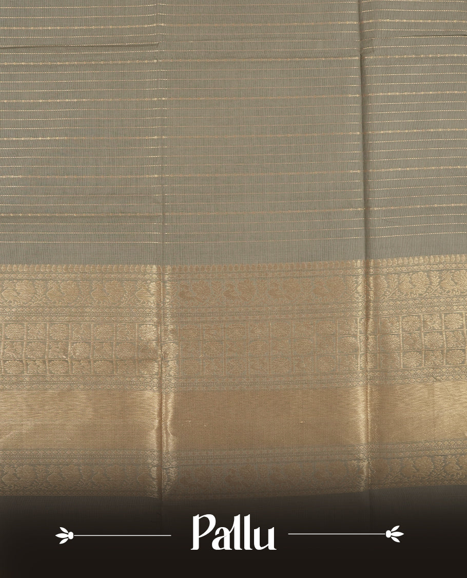 Grey colour Chettinad cotton saree adorned with subtle golden zari lines on the body, The rich ash colour border features intricate peacock and floral motifs in golden zari & Comes with a matching blouse piece.