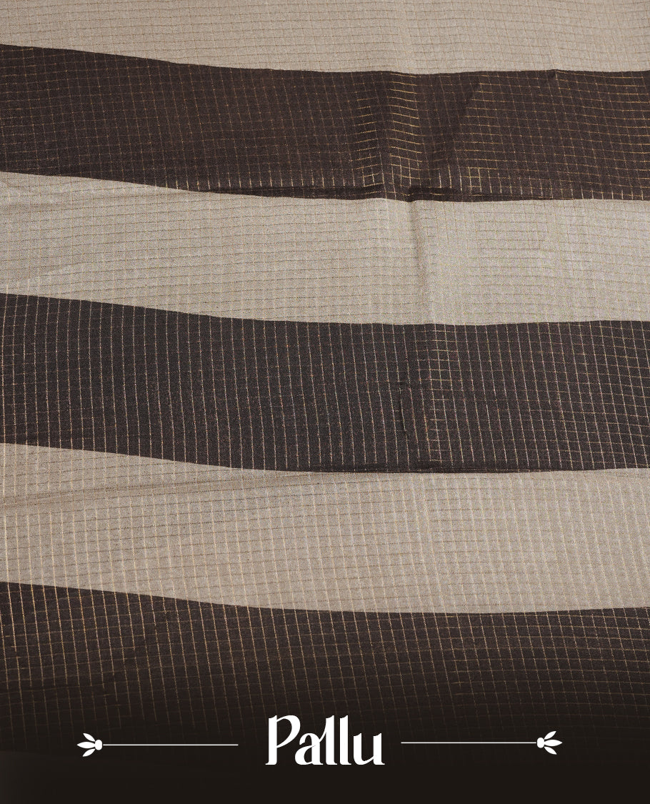 Deep Brown colour saree featuring fine check patterns on the body, paired with a contrast zari woven border and pallu. Comes with a matching blouse piece