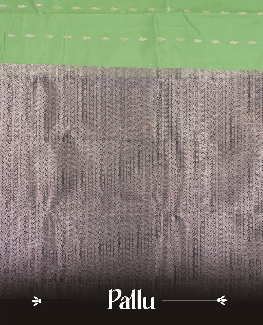 Jade green colour semi soft silk saree featuring a golden textured patterned body, complemented by contrast navy blue with silver zari motifes on pallu & border and a matching blouse piece.