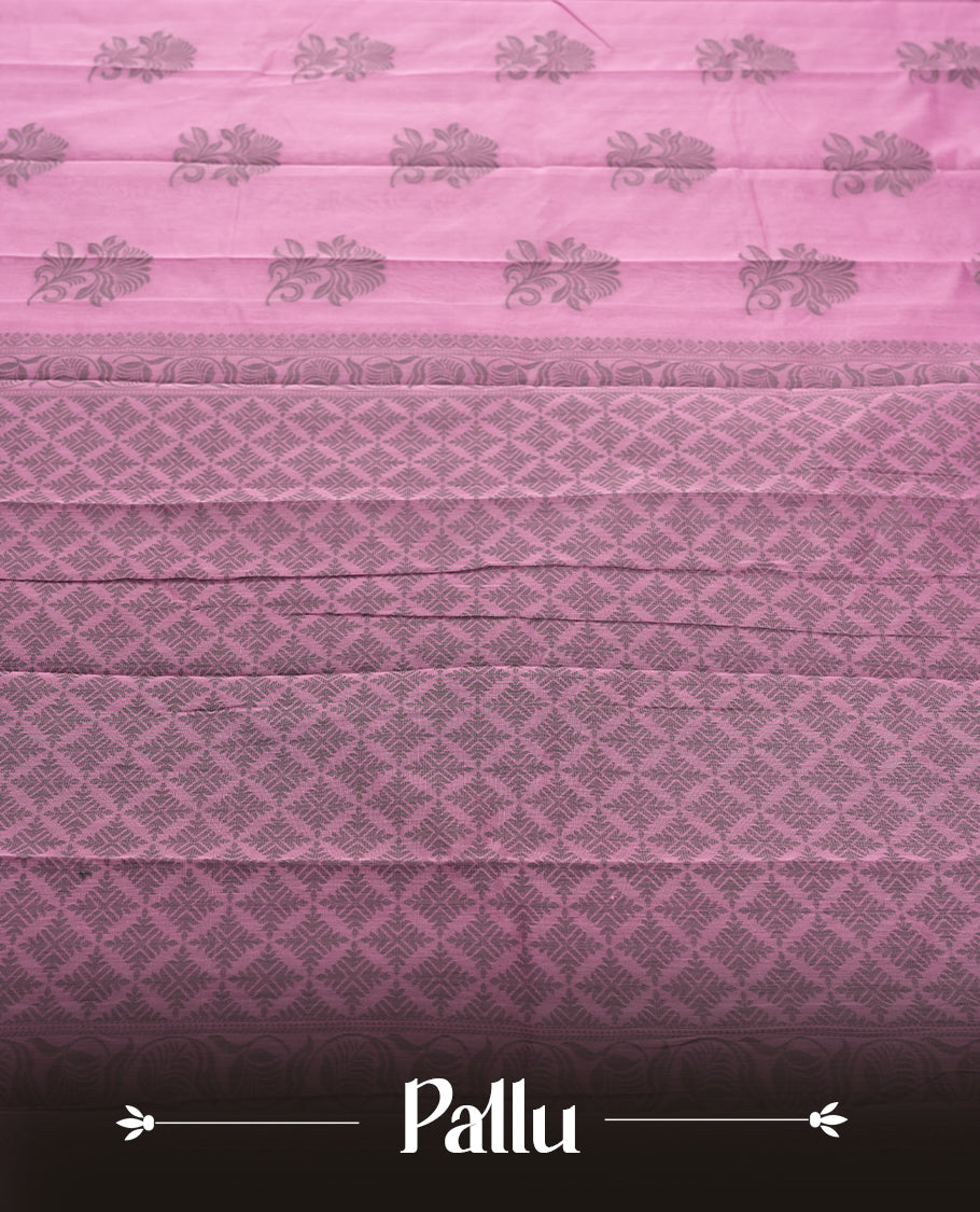 Pastel purple colour silk cotton saree featuring elegant floral zari motifs on the body, complemented by a rich contrast dark border and pallu with traditional woven detailing & Comes with a matching blouse piece.