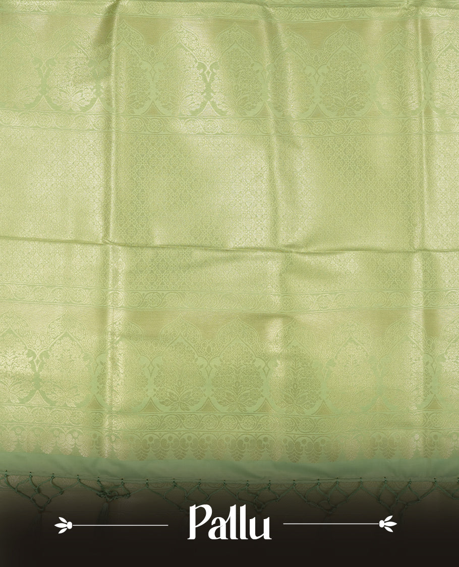 Light Green colour semi soft silk saree featuring an all-over woven leaf pattern in gold colour, finished with a matching border adorned with detailed paisley and floral motifs, and a matching blouse piece.