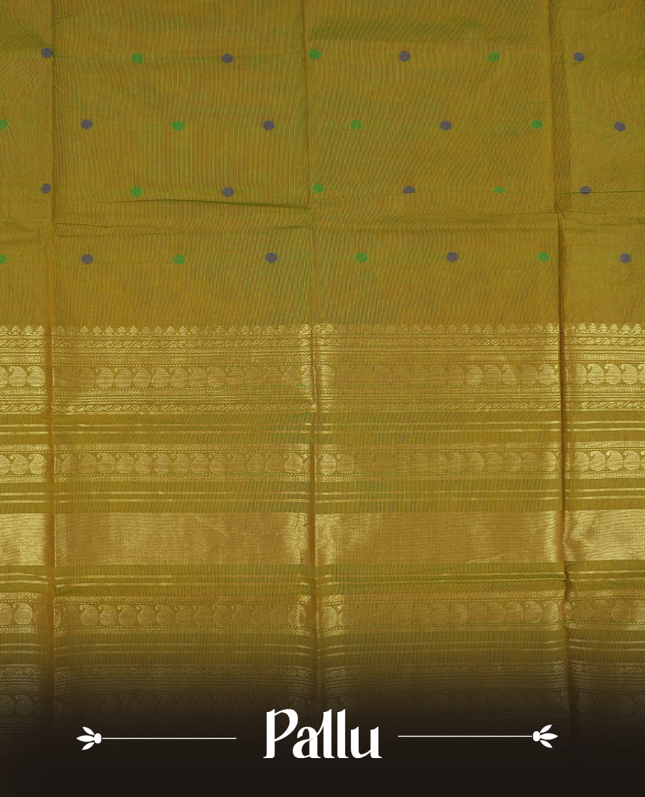 Olive green & Blue dual shaded Chettinad cotton saree adorned with small woven dots on the body, saree features a striking blue and green border with intricate golden zari patterns and geometric motifs & Comes with a matching blouse piece.