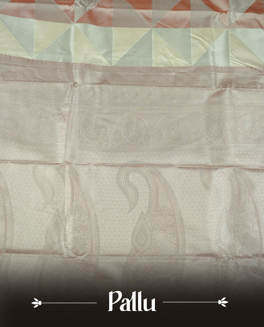 Peach & cream colour semi soft silk saree featuring a silver zari patterned body, complemented by silver zari motifes on pallu & border and a matching blouse piece.