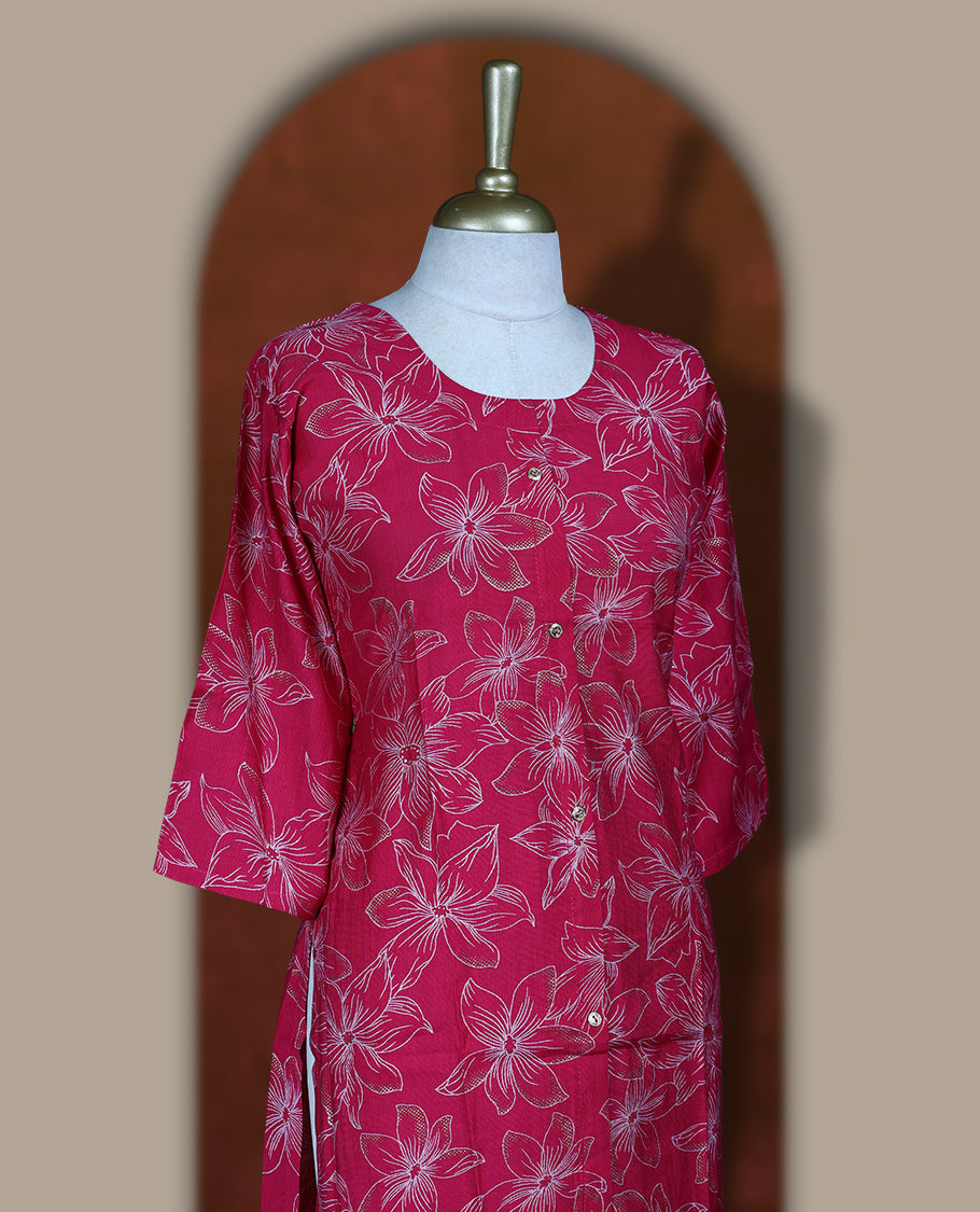 Magenta colour coord set adorned with all over beige colour floral prints, featuring a straight cut kurta with round neckline and 3/4th sleeves, paired with matching bottoms.
