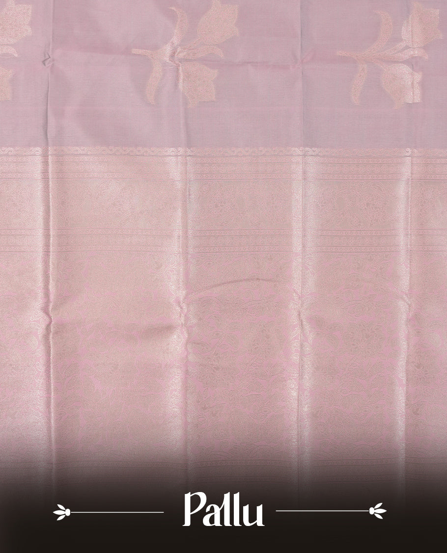 Dusty Lilac Semi Silk Saree with Subtle Zari Butta Motifs, Matching Pastel Lilac Zari Woven Pallu and Border with Intricate Floral Patterns and Tassels, Paired with Coordinated Blouse Piece