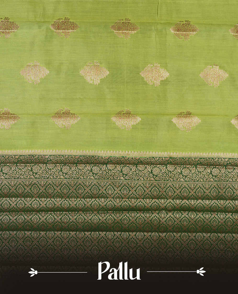 Green Banaras soft silk saree with gold zari motifs on body, with contrast Dark green colour floral pattern on pallu, border, and Matching blouse.