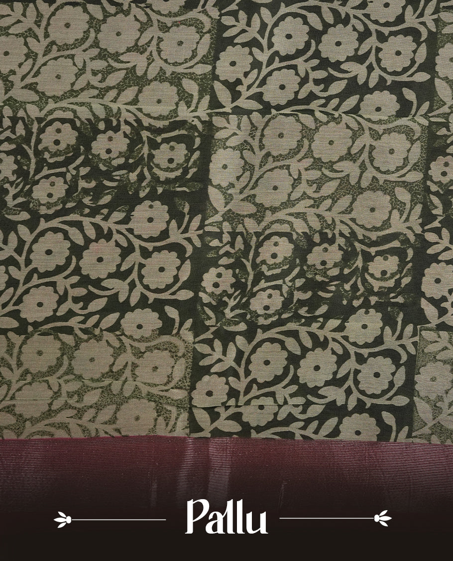 Dark green colour chanderi silk saree featuring floral kodi print pattern across body, with contrast red colour border with zari pattern and paired with matching blouse.