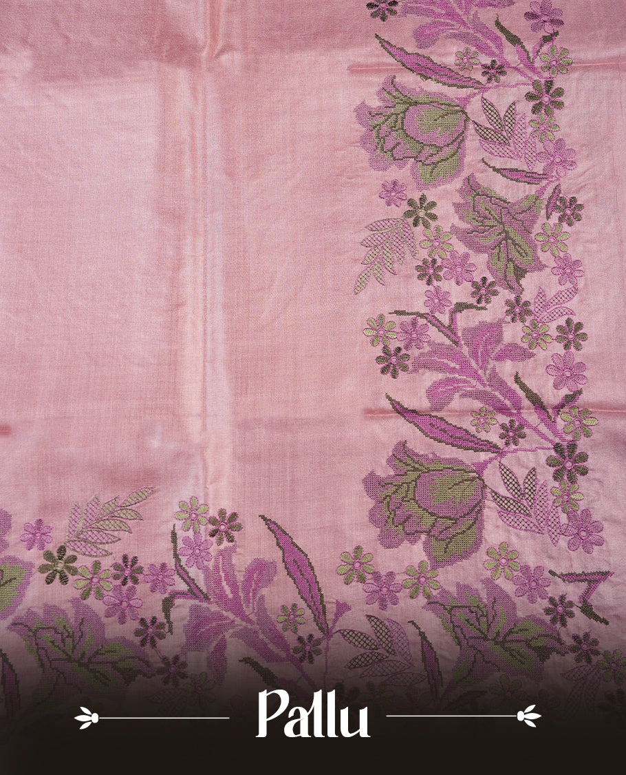 Pastel pink colour Pure tusser silk saree featuring finely crafted floral thread embroidery detailing on the border, pallu and with matching blouse piece.