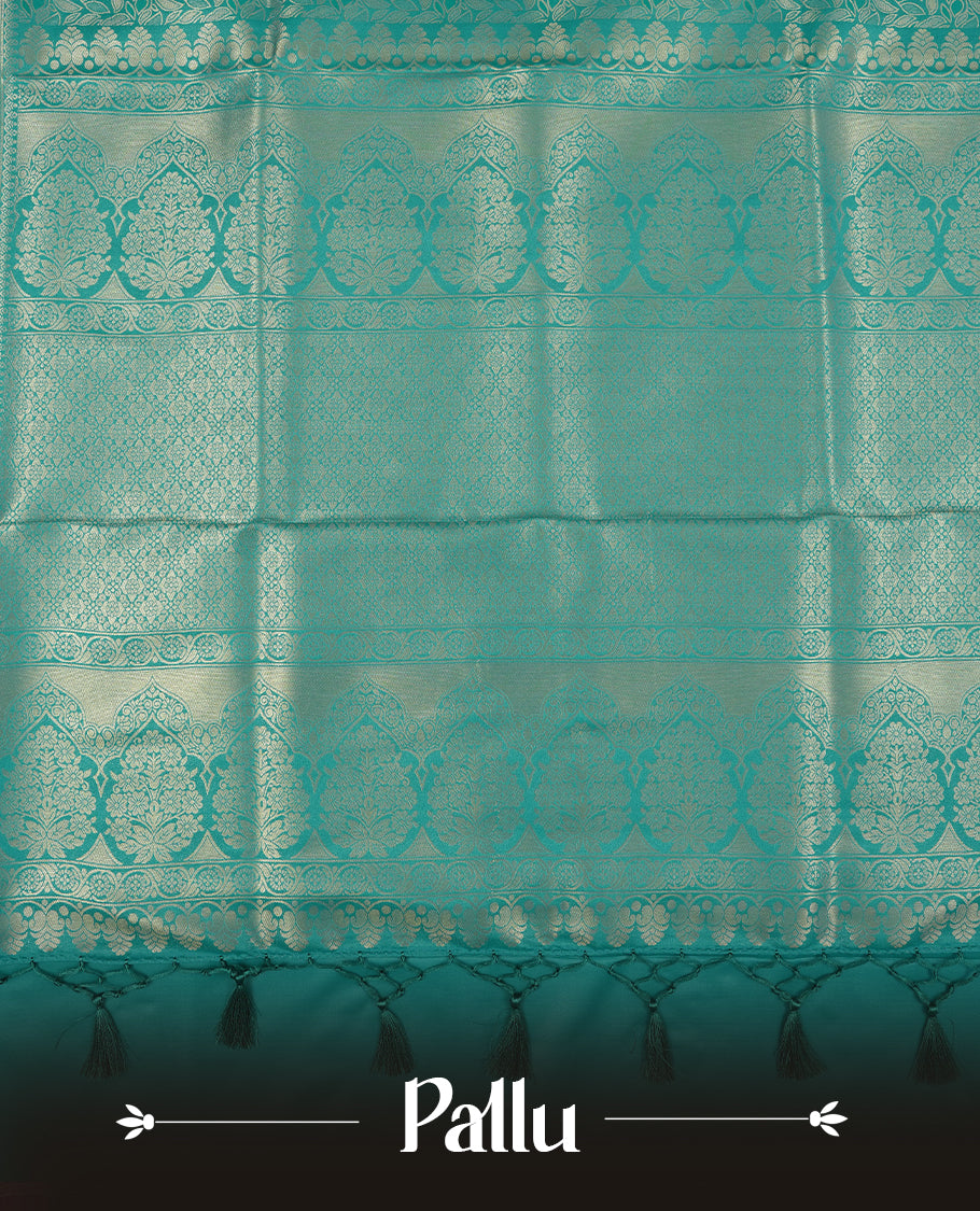 Teal colour semi soft silk saree featuring an all-over woven leaf pattern, finished with a matching border adorned with detailed paisley and floral motifs, and a matching blouse piece.