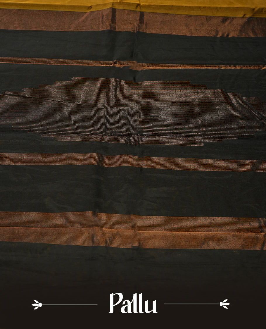 Dark mustard colour silk cotton saree featuring with full of delicate vertical copper zari lines on the body & black contrasted colour pallu, Crafted without a border for a classy touch, Comes with a matching blouse.