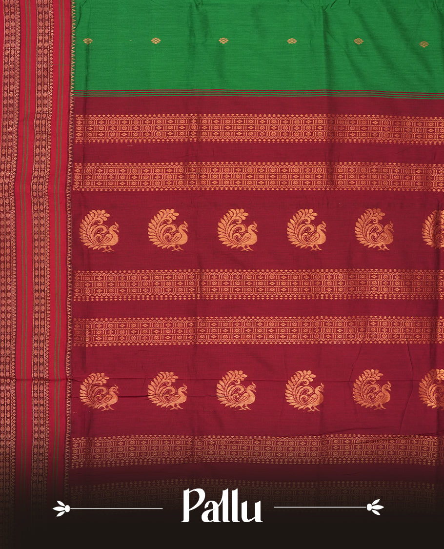 Royal green colour Kalyani cotton saree with contrast maroon border adorned with intricate golden zari weaving & Paired with matching blouse.