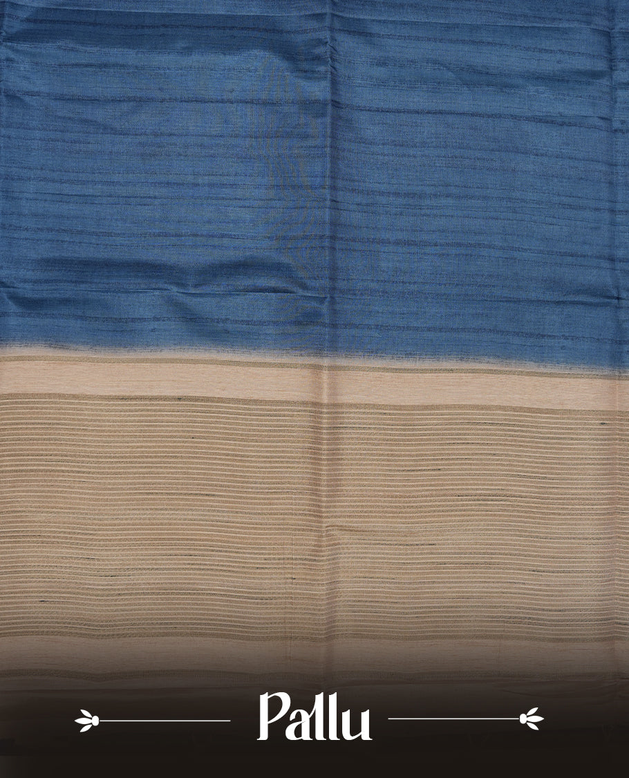 Blue colour semi tusser silk saree featuring contrast cream colour London bridge printed pattern border and paired with matching blouse.