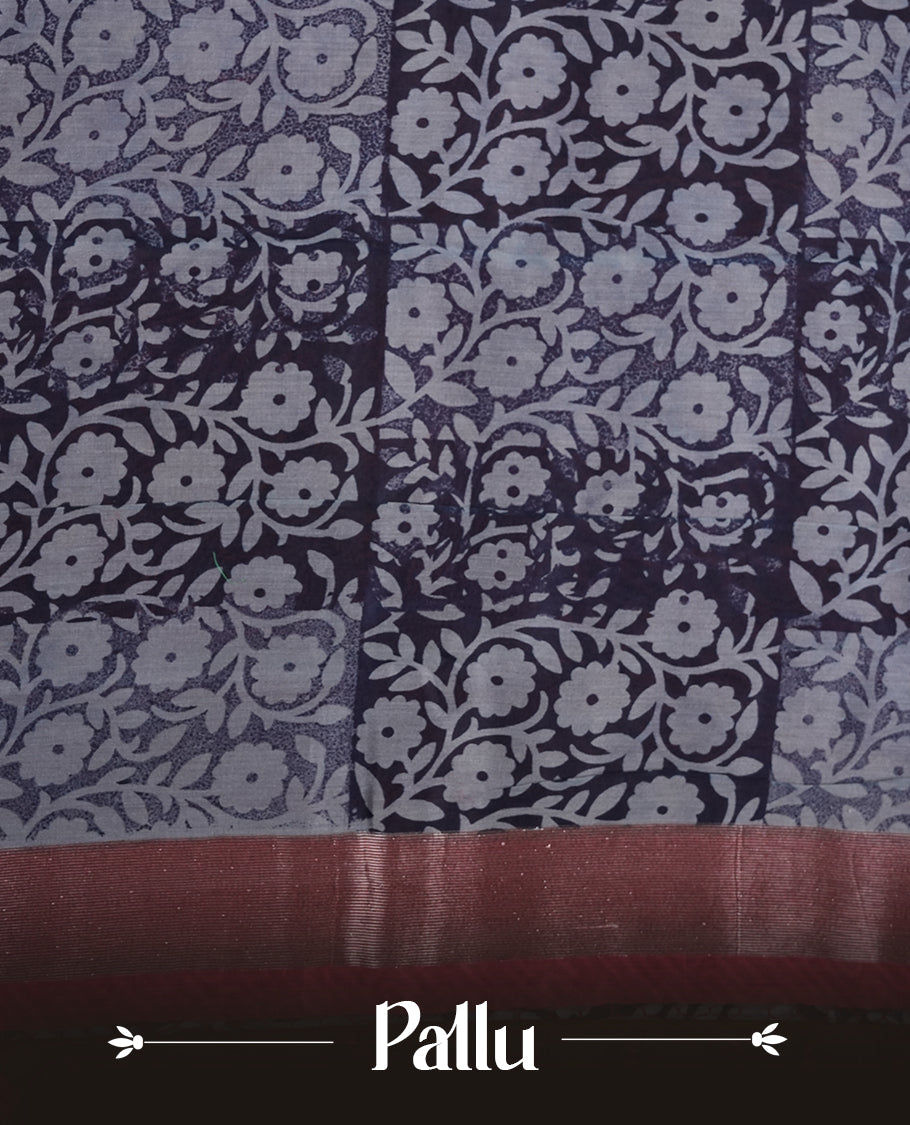 Dark blue colour chanderi silk saree featuring floral kodi print pattern across body, with contrast red colour border with zair pattern and paired with matching blouse.