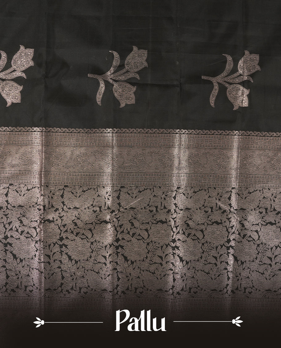 Black Semi Silk Saree with Silver Zari Floral Woven Pallu and Border, Subtle Zari Butta Motifs on the Body, Tassel Detailing, and Coordinated Blouse Piece