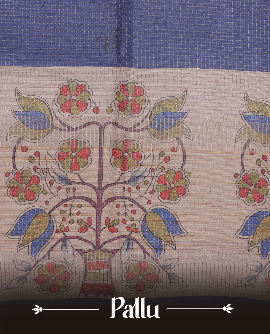 Wheat colour semi tussar silk saree featuring floral print and check pattern across body, contrast blue colour border and pallu, paired with matching blouse piece.