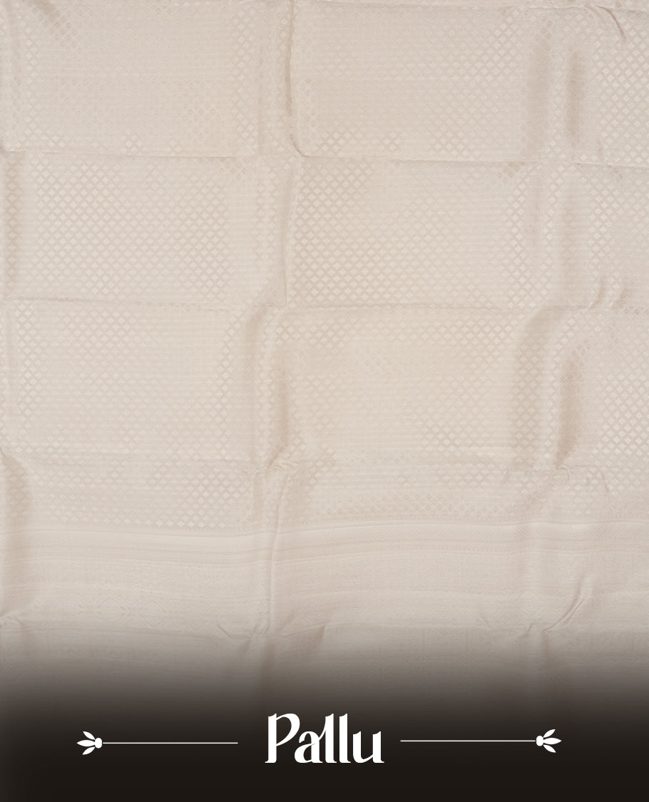 Off white colour semi soft silk saree featuring a self coloured textured patterned body, complemented by self coloured Square motifs on pallu & border and a matching blouse piece.