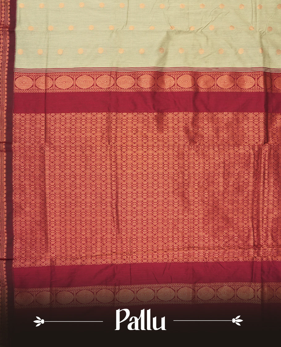 Grey colour Kalyani Cotton saree in deep maroon with golden motifs, paired with a contrasting maroon border featuring intricate zari work & Comes with a matching blouse piece.