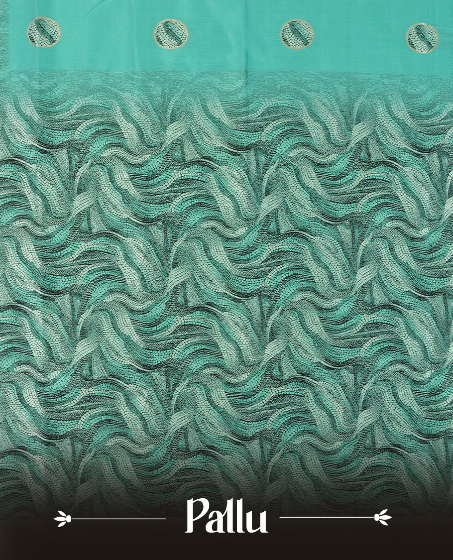 Aqua green semi silk saree featuring elegant circular motifs on the body, complemented by a striking pallu adorned with intricate wavy white and black thread patterns with golden border, and paired with a matching blouse
