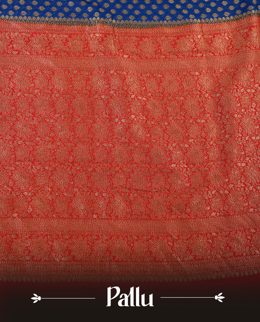 Dark Blue colour pure Banarasi Crepe saree featuring Antique zari Flower Motifs all over the body, complemented by an contrast Red dye colour with gold zari Floral Kodi Worked border and pallu, with matching blouse.