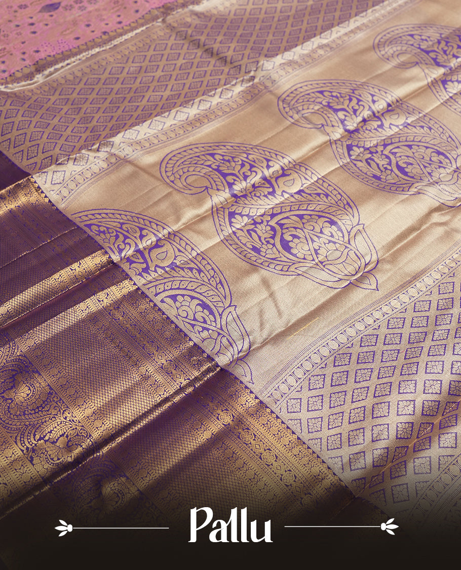 Pink colour and Antique gold Zari Tissue Brocade Saree features intricate blue colourred floral Motifs on body and a navy blue colour traditional border & pallu with floral patterns, paired with matching blouse
