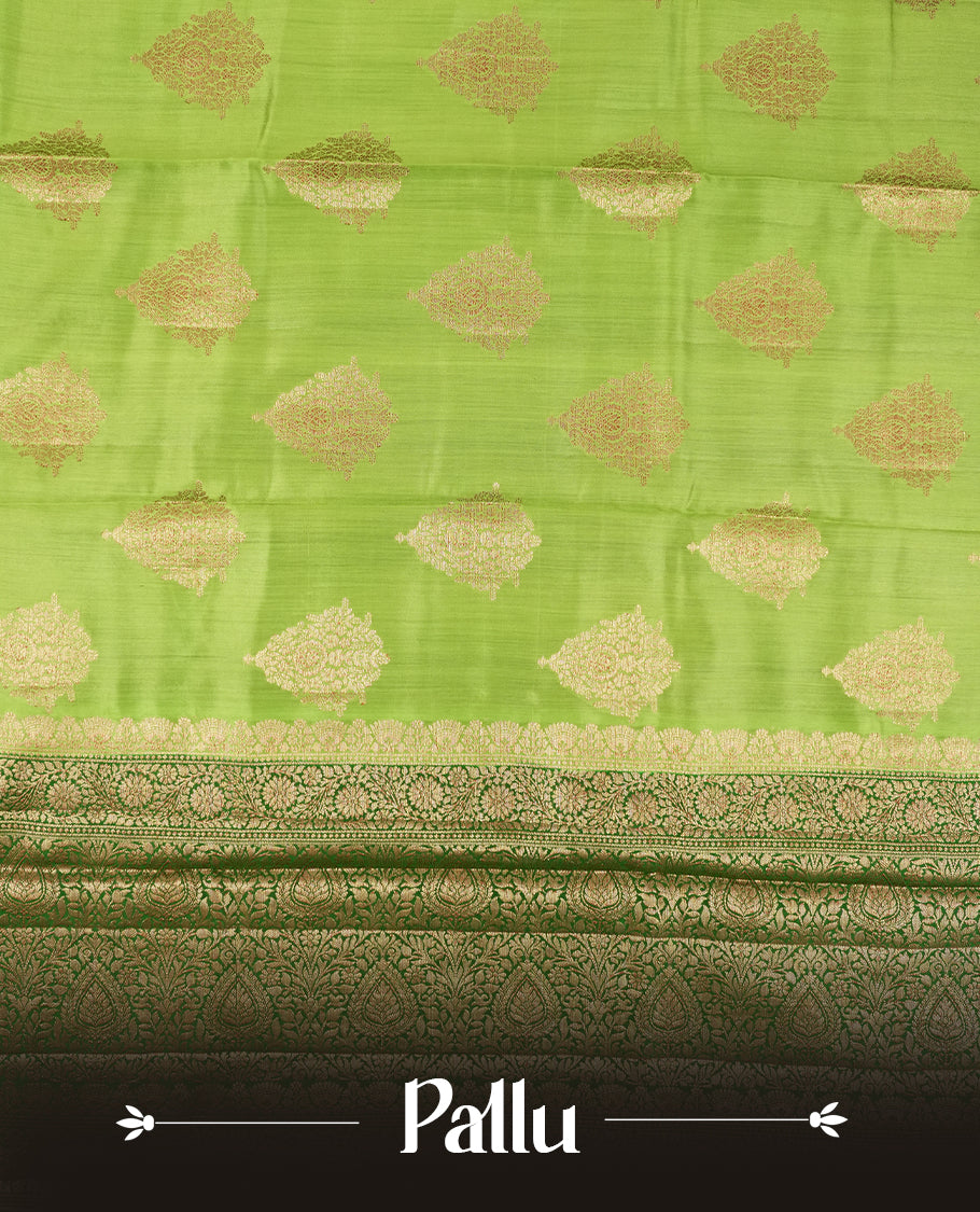Parrot Green Colour Banaras Soft Silk Saree with Gold Zari Textured Diamond-Shaped Buttas, Simple Decorative Pallu Border, Grand Pallu with Ornate Circular and Floral Motifs in Forest Green and Gold Tones, and Matching Forest Green Blouse.